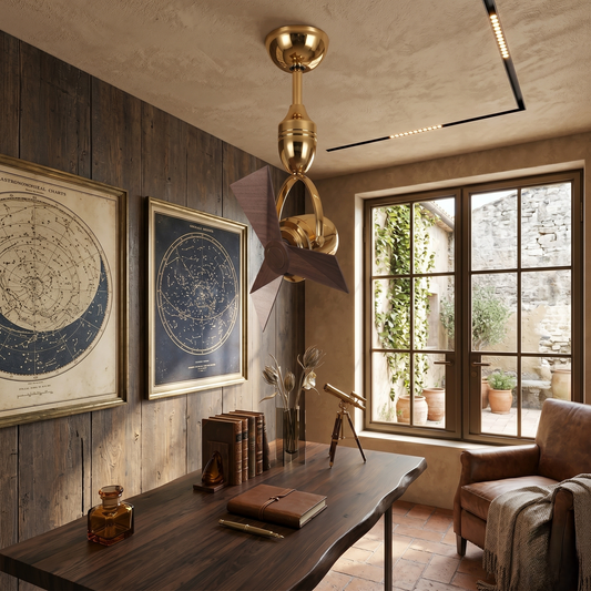Cozy room with wooden desk, armchair, Aviator Dual-Axis Ceiling Fan and framed celestial maps.